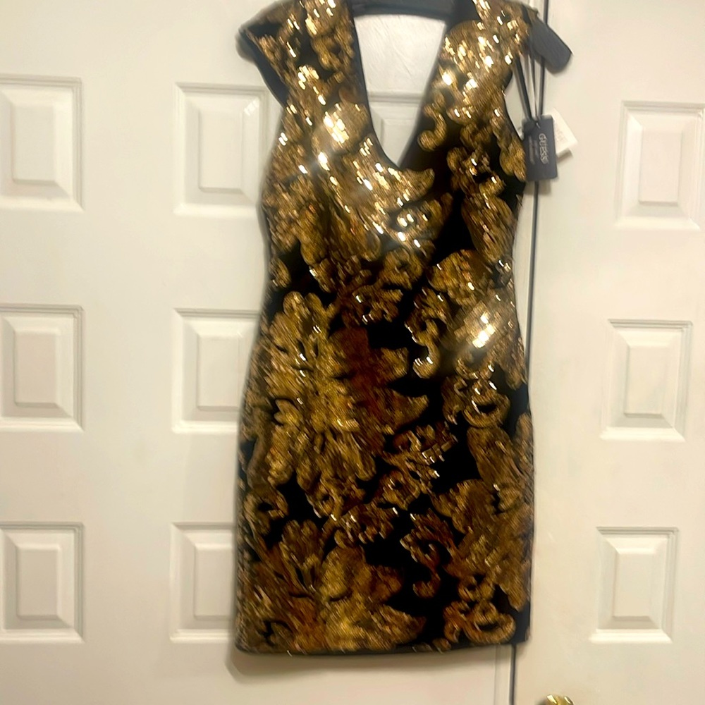 Evening black dress with golden glitter, with black backing. ￼